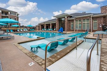Resort-style swimming pool with sundeck for lounging